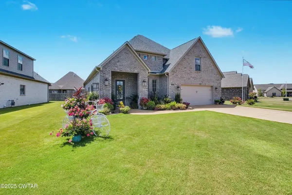 a front view of house with garden