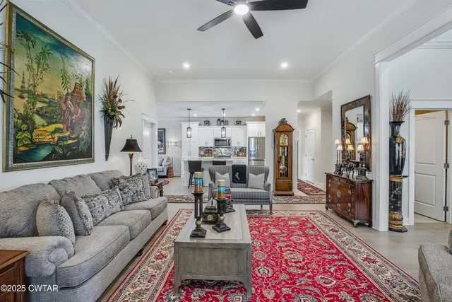a living room with furniture and a rug