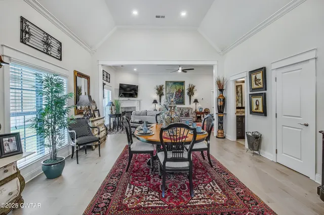 a living room with furniture and a rug