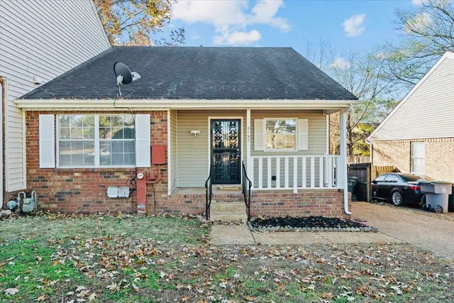 an outdoor view of house with backyard