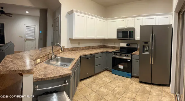 a bathroom with a sink a toilet and a bathtub