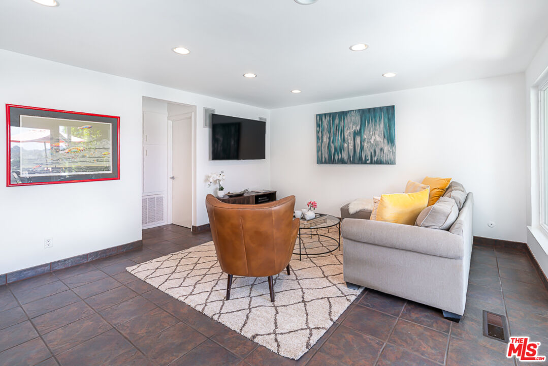 2866 Angelo Drive Los Angeles, CA 90077 - Photo 12 of 31 a living room with furniture and a flat screen tv
