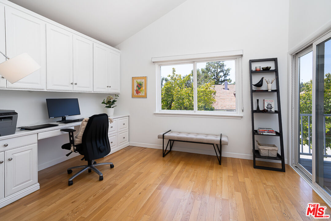 2866 Angelo Drive Los Angeles, CA 90077 - Photo 14 of 31 a view of a workspace with furniture and a window