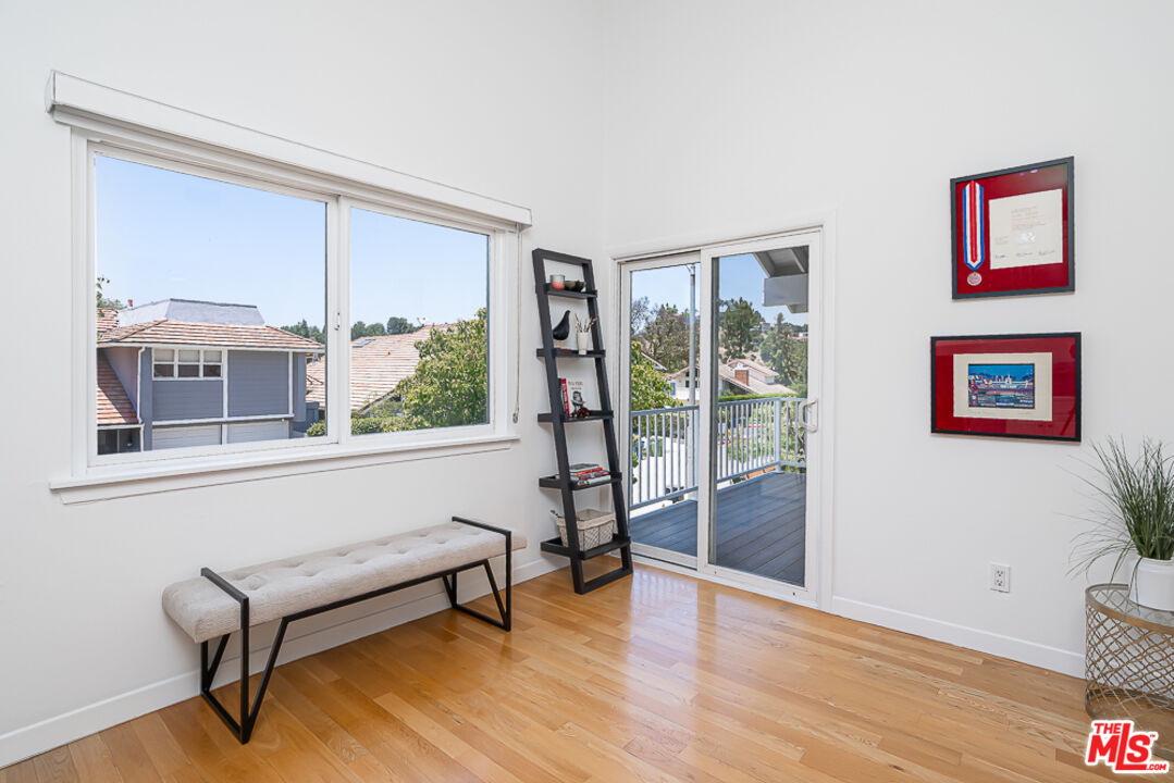 2866 Angelo Drive Los Angeles, CA 90077 - Photo 15 of 31 a living room with furniture and a window