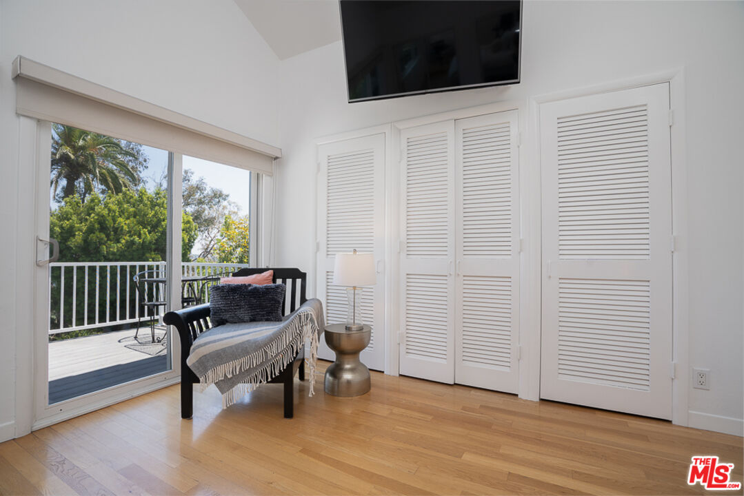 2866 Angelo Drive Los Angeles, CA 90077 - Photo 20 of 31 a view of a room with wooden floor and lounge chairs
