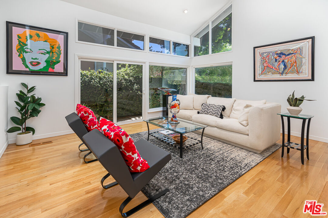 2866 Angelo Drive Los Angeles, CA 90077 - Photo 2 of 31 a living room with furniture and a large window