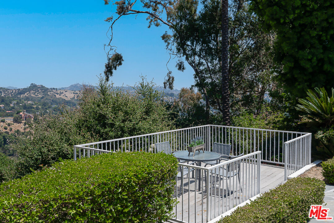2866 Angelo Drive Los Angeles, CA 90077 - Photo 27 of 31 a view of a roof deck with wooden fence