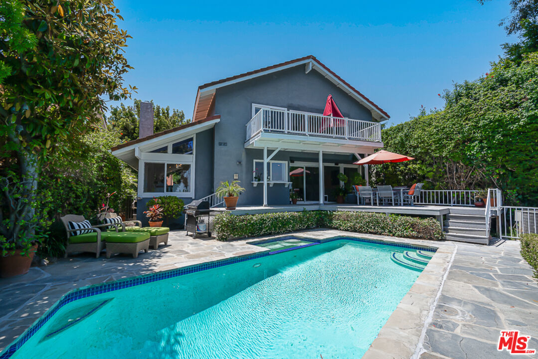 2866 Angelo Drive Los Angeles, CA 90077 - Photo 30 of 31 a view of a house with a yard patio and a fire pit