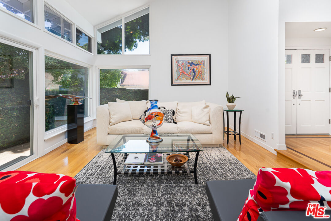 2866 Angelo Drive Los Angeles, CA 90077 - Photo 3 of 31 a living room with furniture and a large window