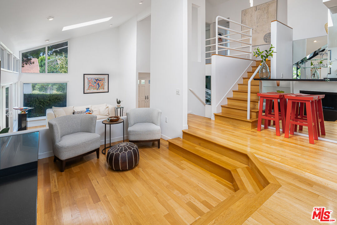 2866 Angelo Drive Los Angeles, CA 90077 - Photo 6 of 31 a living room with furniture and a table