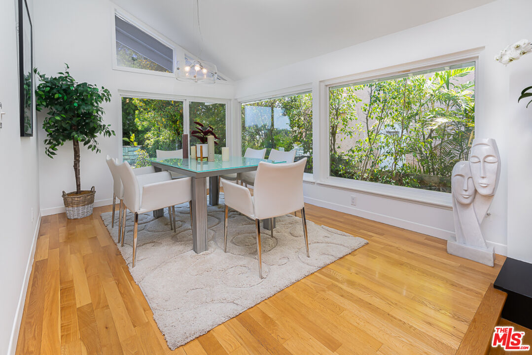 2866 Angelo Drive Los Angeles, CA 90077 - Photo 8 of 31 a living room with furniture and a large window