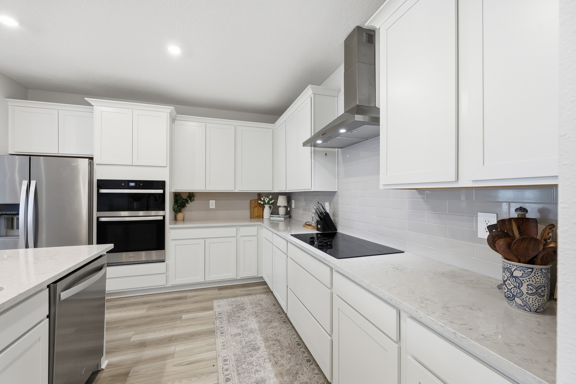 95026 Rocky Place Fernandina Beach, FL 32034 - Photo 15 of 53 a kitchen with white cabinets and stainless steel appliances