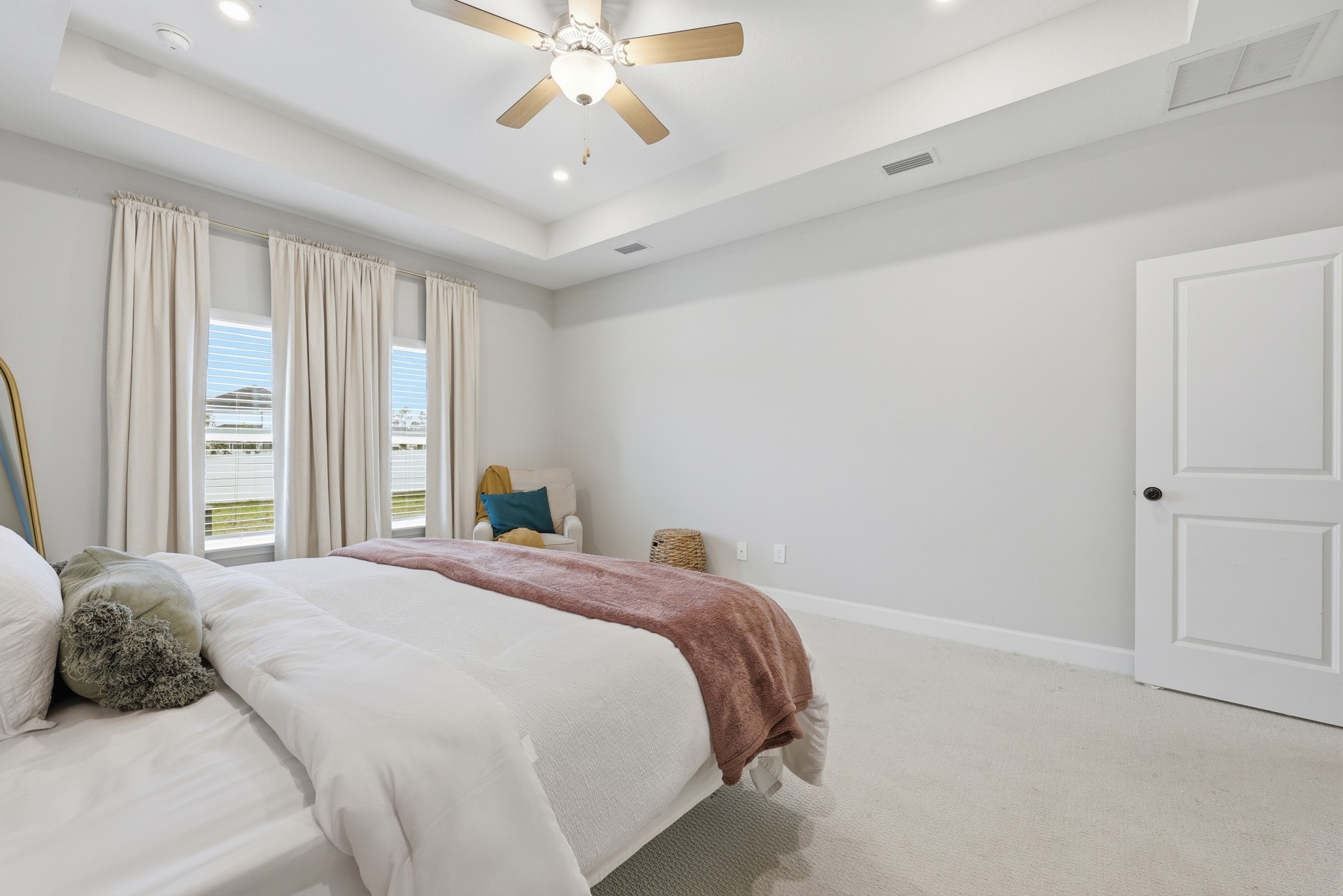 95026 Rocky Place Fernandina Beach, FL 32034 - Photo 22 of 53 a bedroom with a large bed and a chandelier