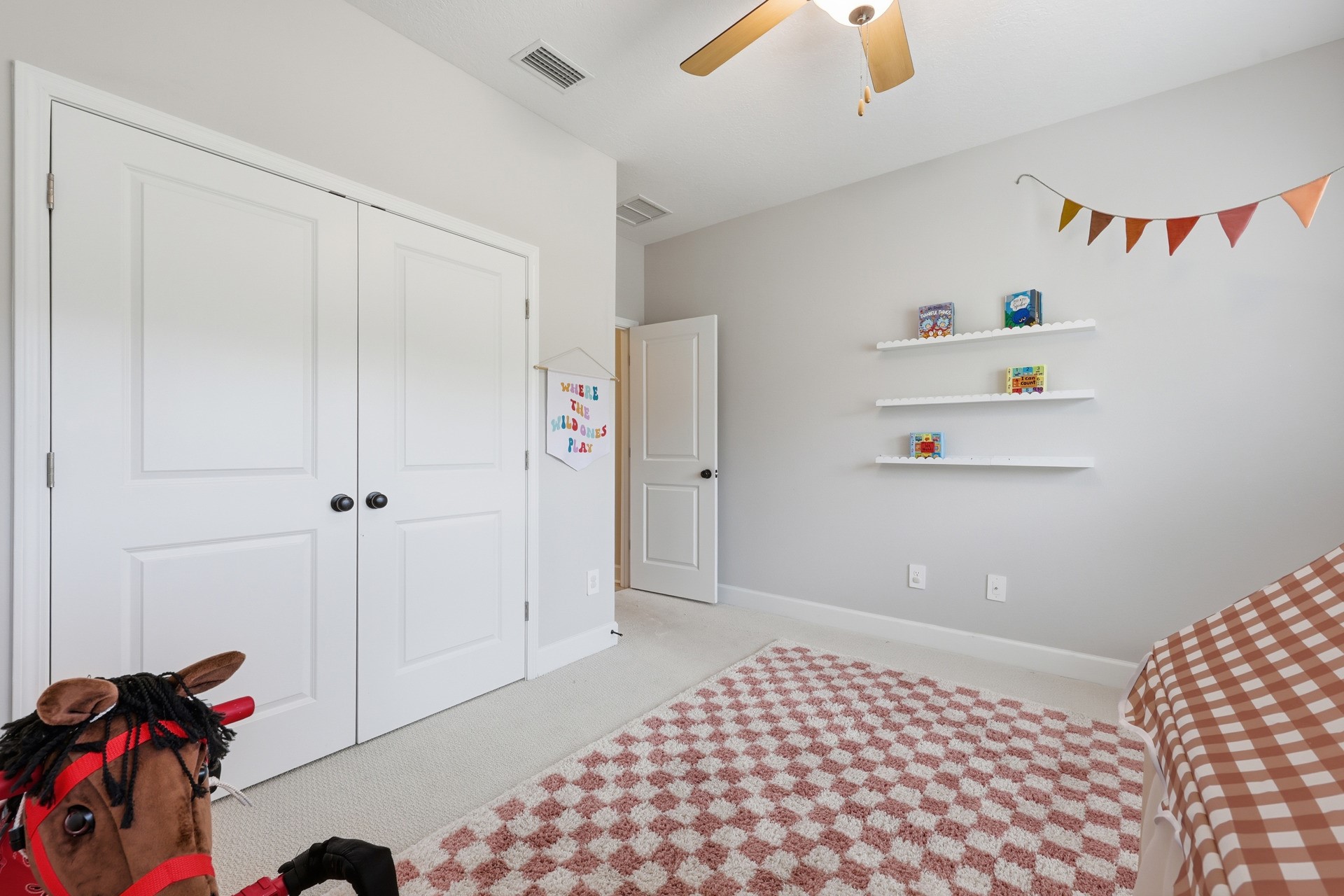 95026 Rocky Place Fernandina Beach, FL 32034 - Photo 38 of 53 a bedroom with a bed and a chandelier