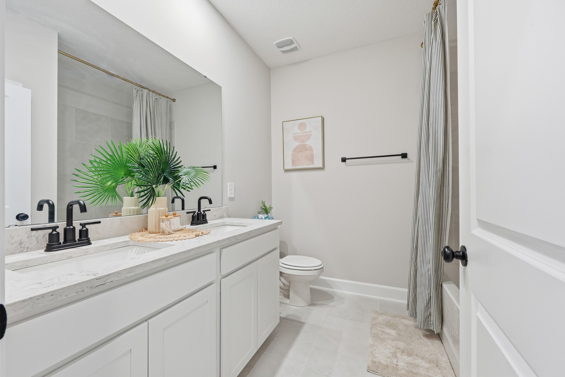95026 Rocky Place Fernandina Beach, FL 32034 - Photo 39 of 53 a bathroom with a sink a toilet a mirror and vanity