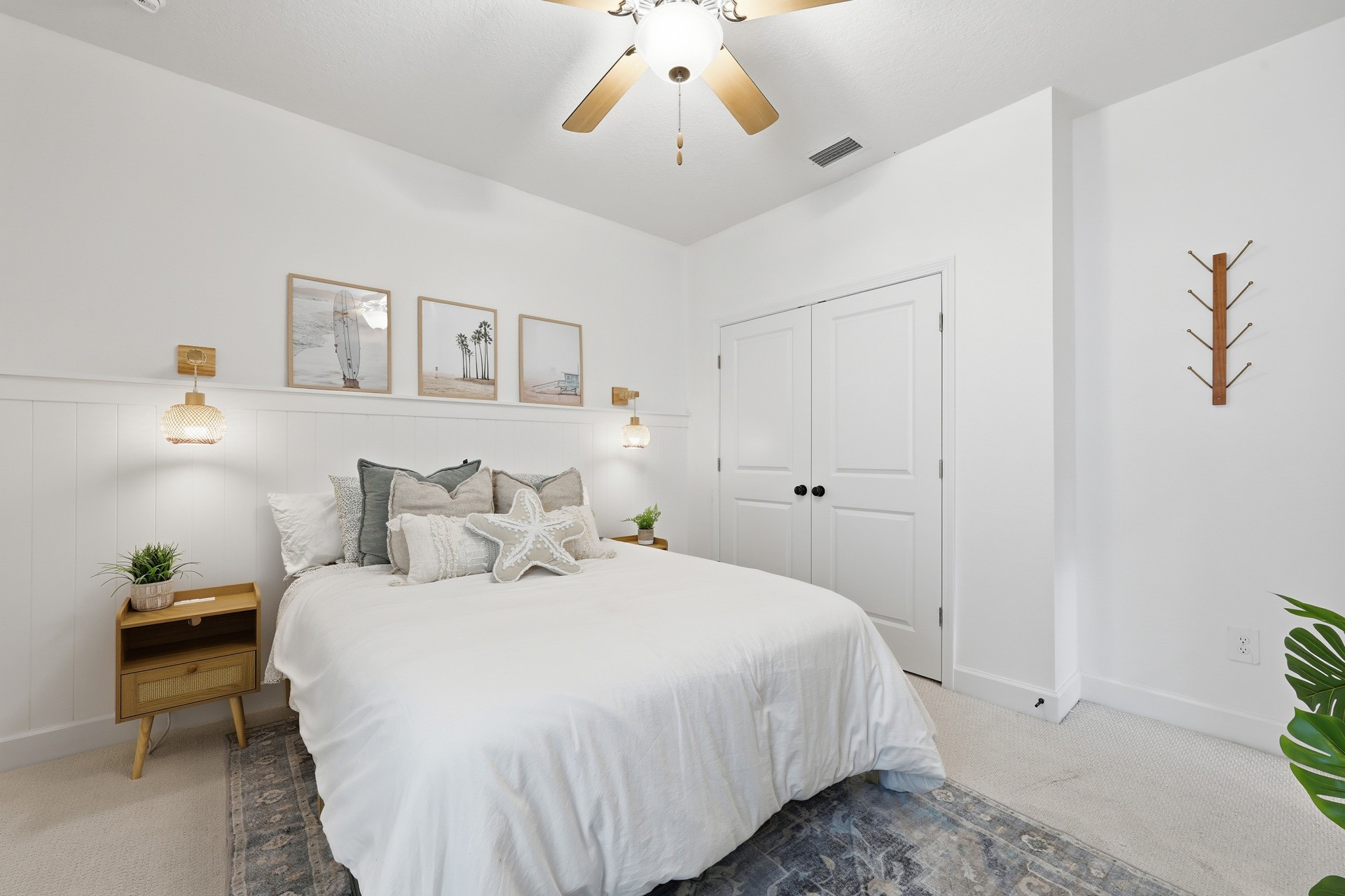 95026 Rocky Place Fernandina Beach, FL 32034 - Photo 44 of 53 a spacious bedroom with a bed and a chandelier