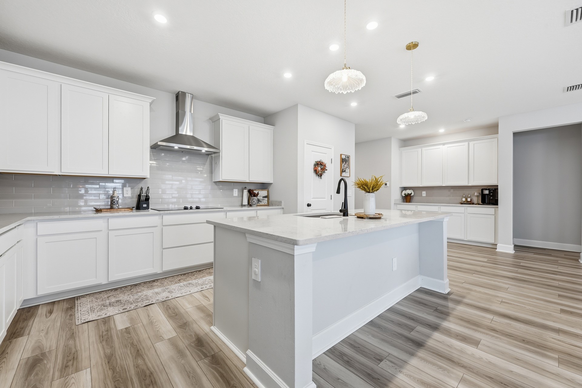 95026 Rocky Place Fernandina Beach, FL 32034 - Photo 6 of 53 a kitchen with white cabinets appliances and a sink