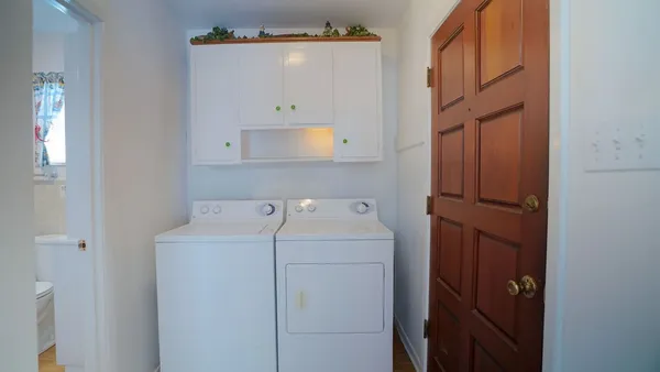 a utility room with dryer and washer