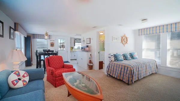 a bedroom with furniture and a bathtub