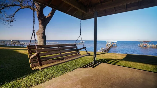 a view of outdoor space with wooden floor and potted plants