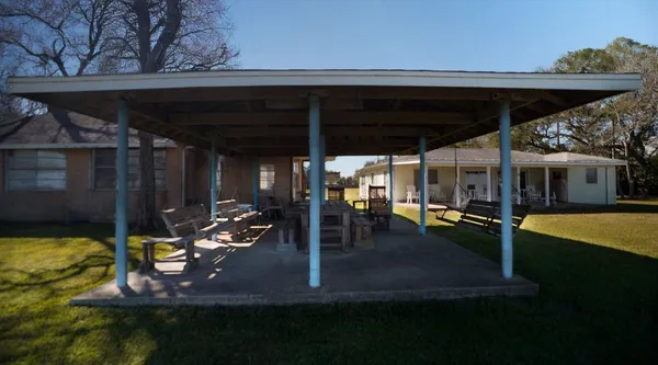 a view of a swimming pool with a patio
