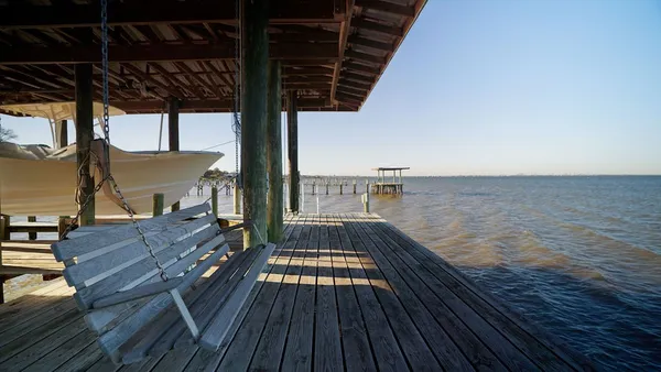 a view of balcony with wooden floor