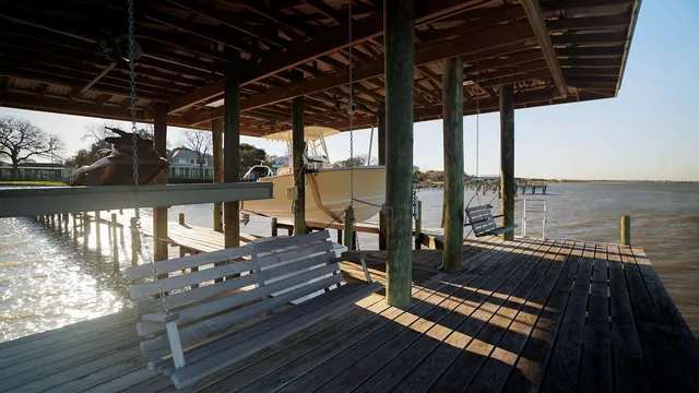 a view of a balcony with wooden floor and outdoor space