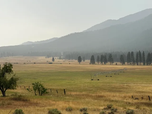 a view of an ocean and mountains