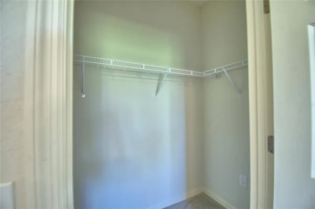 a view of an empty room with a sliding door