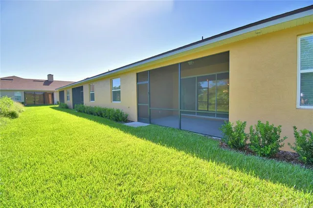 a view of a chair and table in front of the house