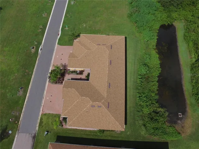 a large kitchen with stainless steel appliances lots of counter top space and living room