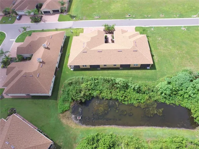 a large kitchen with a large counter top appliances and cabinets