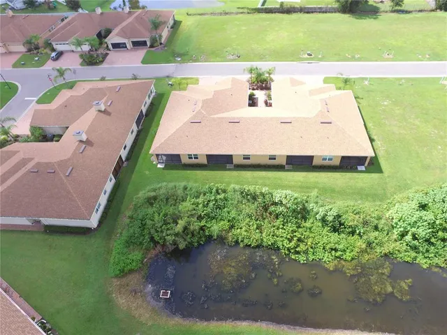 a media room with lots of chairs and a wooden floor