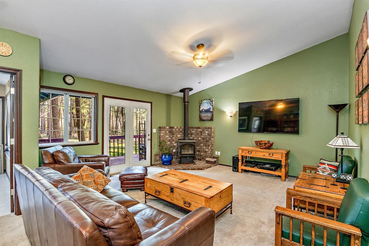 4623 Dick George Road Cave Junction, OR 97523 - Photo 10 of 26 a living room with furniture and a flat screen tv