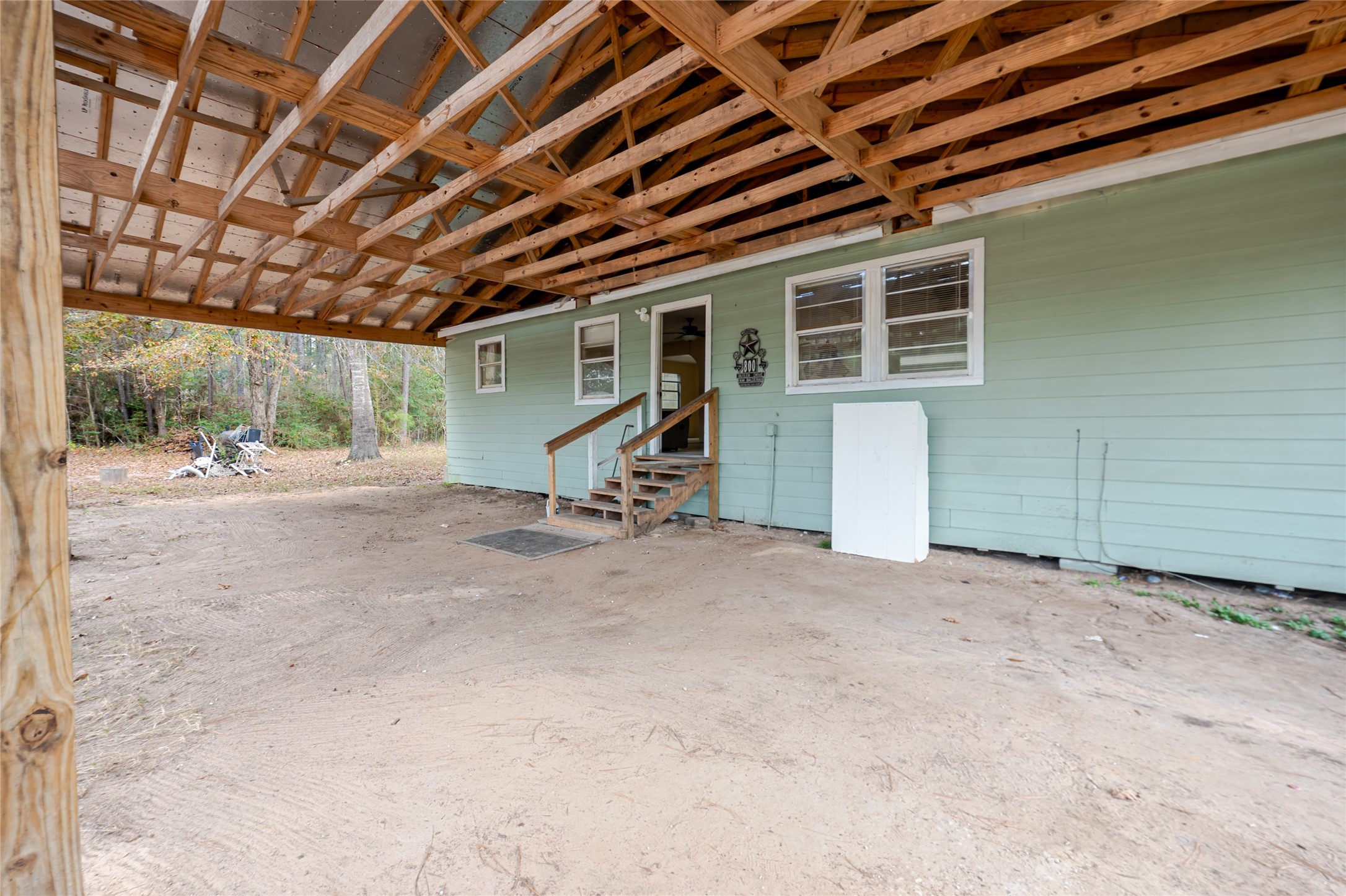 800 Butler Drive Cleveland, TX 77328 - Photo 5 of 11 a view of a big room with wooden walls