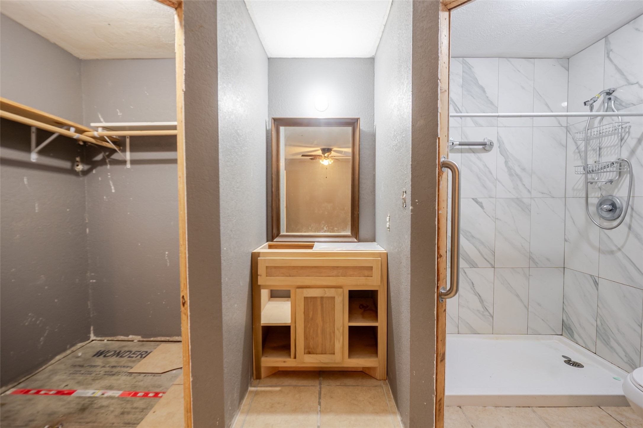 800 Butler Drive Cleveland, TX 77328 - Photo 9 of 11 a bathroom with a sink and a shower