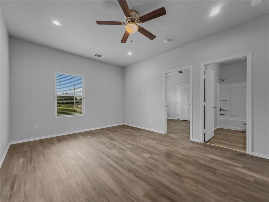 2 Bowling Lane Blue Ridge, TX 75424 - Photo 10 of 14 wooden floor in an empty room with a window