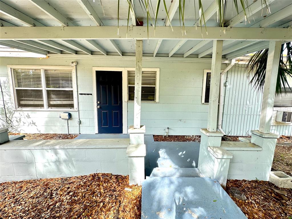 1102 Sunset Point Road, Unit 2 Clearwater, FL 33755 - Photo 11 of 11 a view of a patio with table and chairs