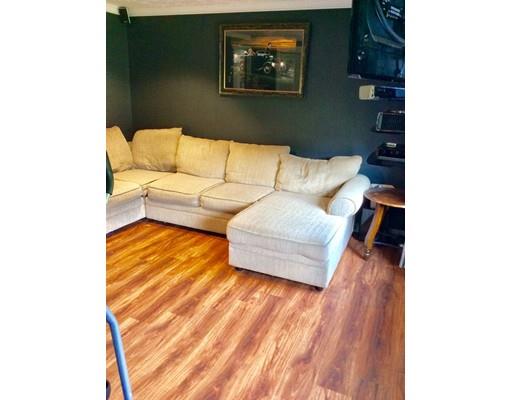 168 Corbin Road Dudley, MA 01571 - Photo 13 of 42 a living room with furniture and a wooden floor