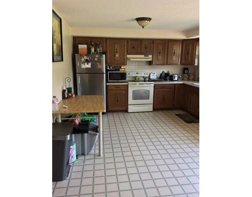 168 Corbin Road Dudley, MA 01571 - Photo 17 of 42 a kitchen with stainless steel appliances a refrigerator and a stove