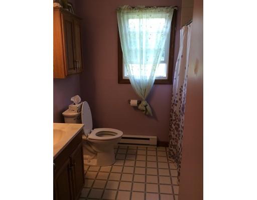 168 Corbin Road Dudley, MA 01571 - Photo 21 of 42 a bathroom with a toilet and a shower curtain