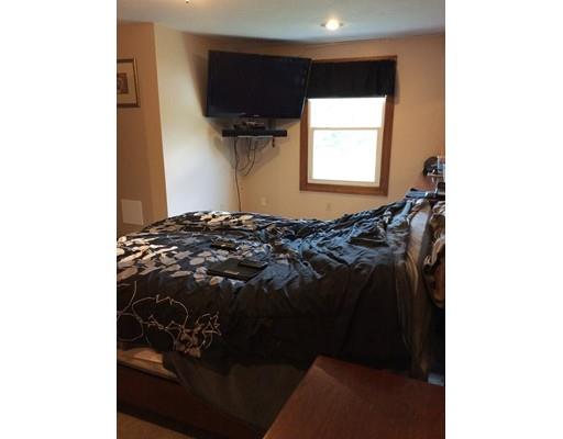 168 Corbin Road Dudley, MA 01571 - Photo 27 of 42 a bed sitting in a bedroom next to a window