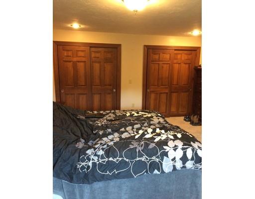 168 Corbin Road Dudley, MA 01571 - Photo 28 of 42 a bedroom with a bed and a dresser