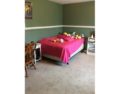 168 Corbin Road Dudley, MA 01571 - Photo 29 of 42 a bedroom with a bed and a table