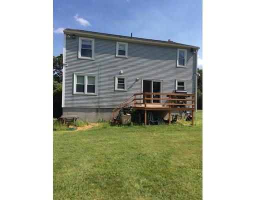 168 Corbin Road Dudley, MA 01571 - Photo 4 of 42 a backyard of a house with table and chairs