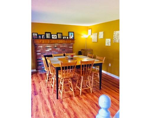 168 Corbin Road Dudley, MA 01571 - Photo 10 of 42 a dining room with furniture and a floor to ceiling window