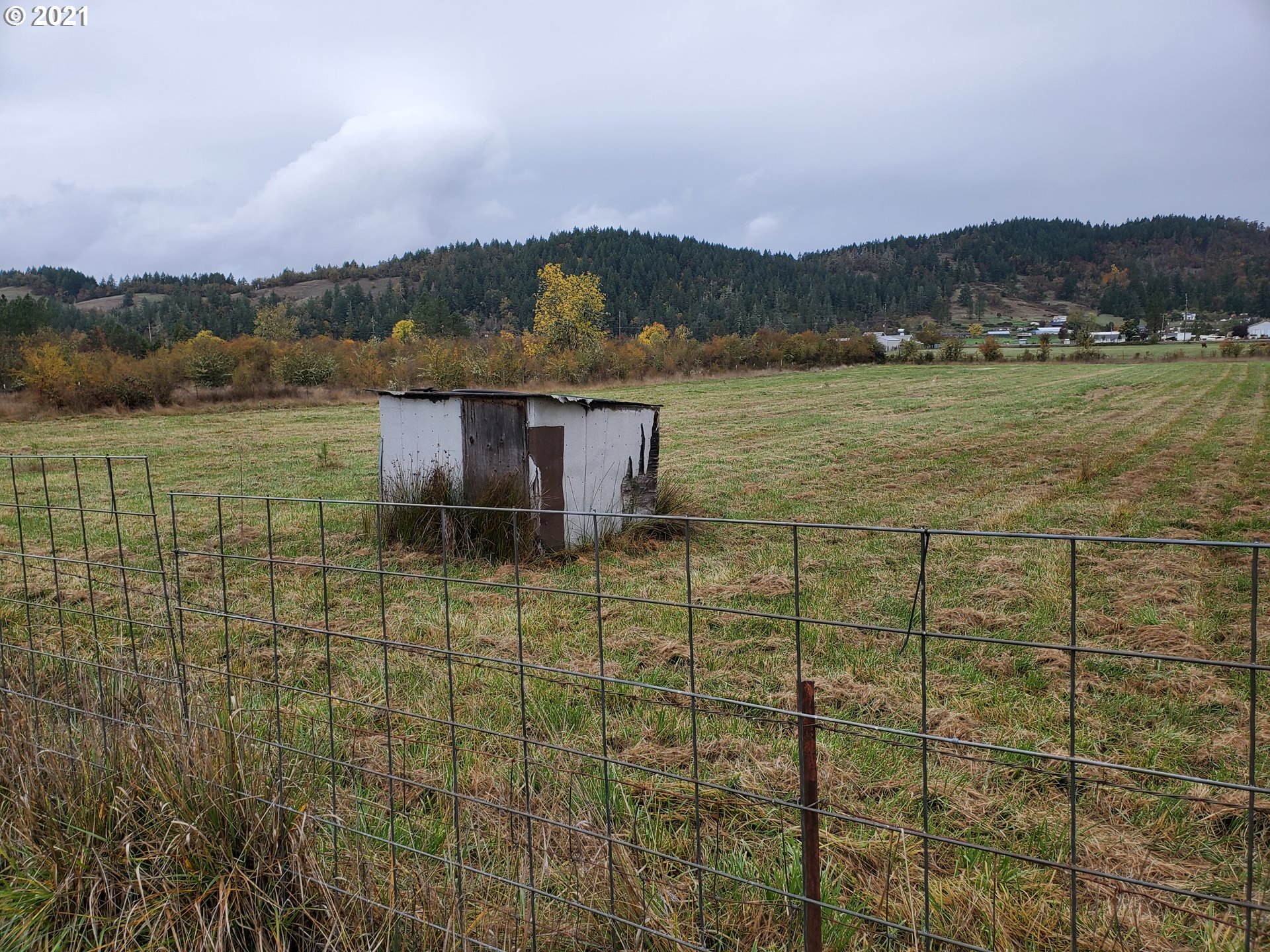 732 Valley View Road Sutherlin, OR 97479 - Photo 12 of 16 a view of a lake with a mountain in the background