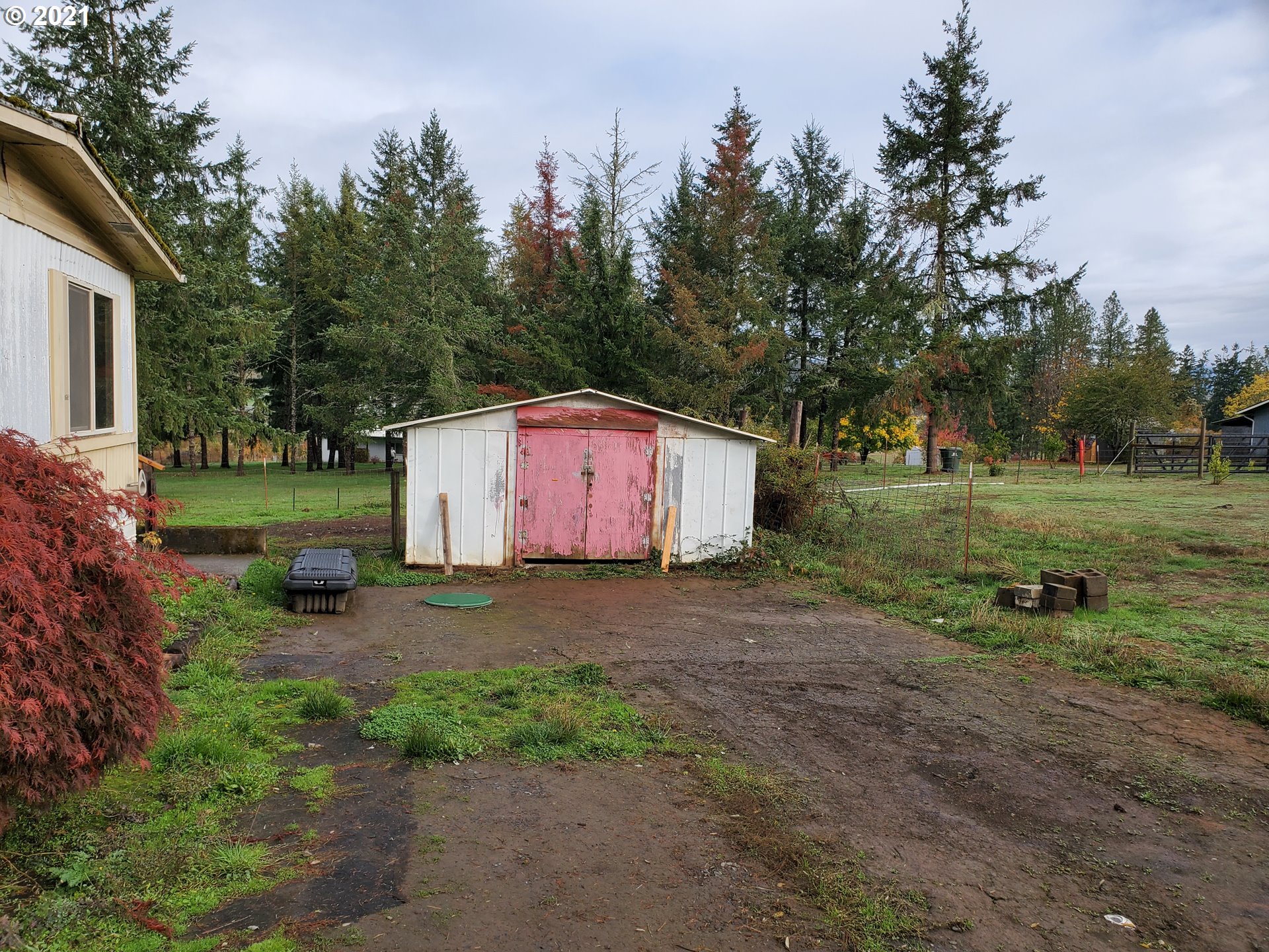 732 Valley View Road Sutherlin, OR 97479 - Photo 15 of 16 a front view of a house with a yard and trees