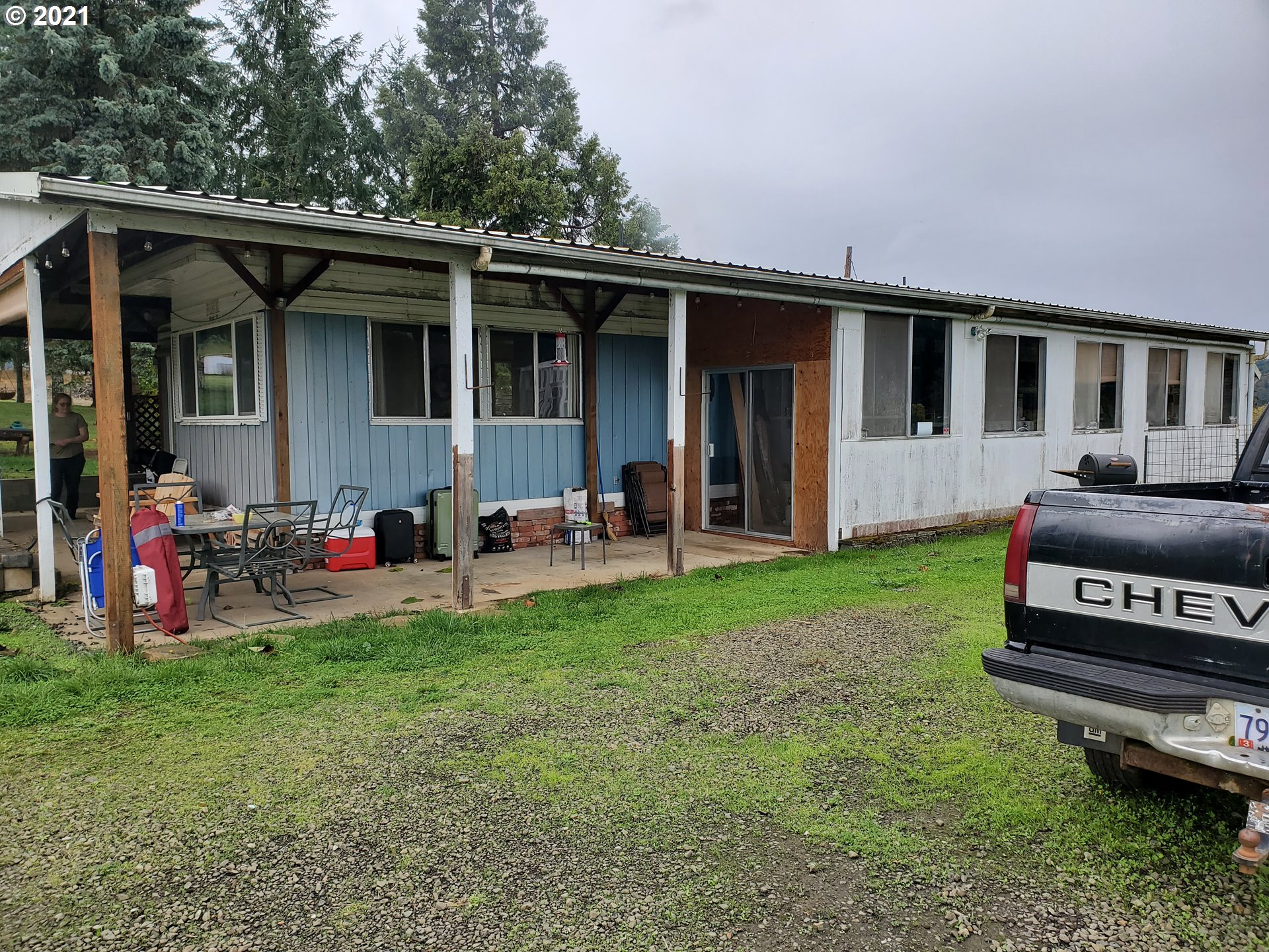 732 Valley View Road Sutherlin, OR 97479 - Photo 8 of 16 a view of a house with a yard and sitting area