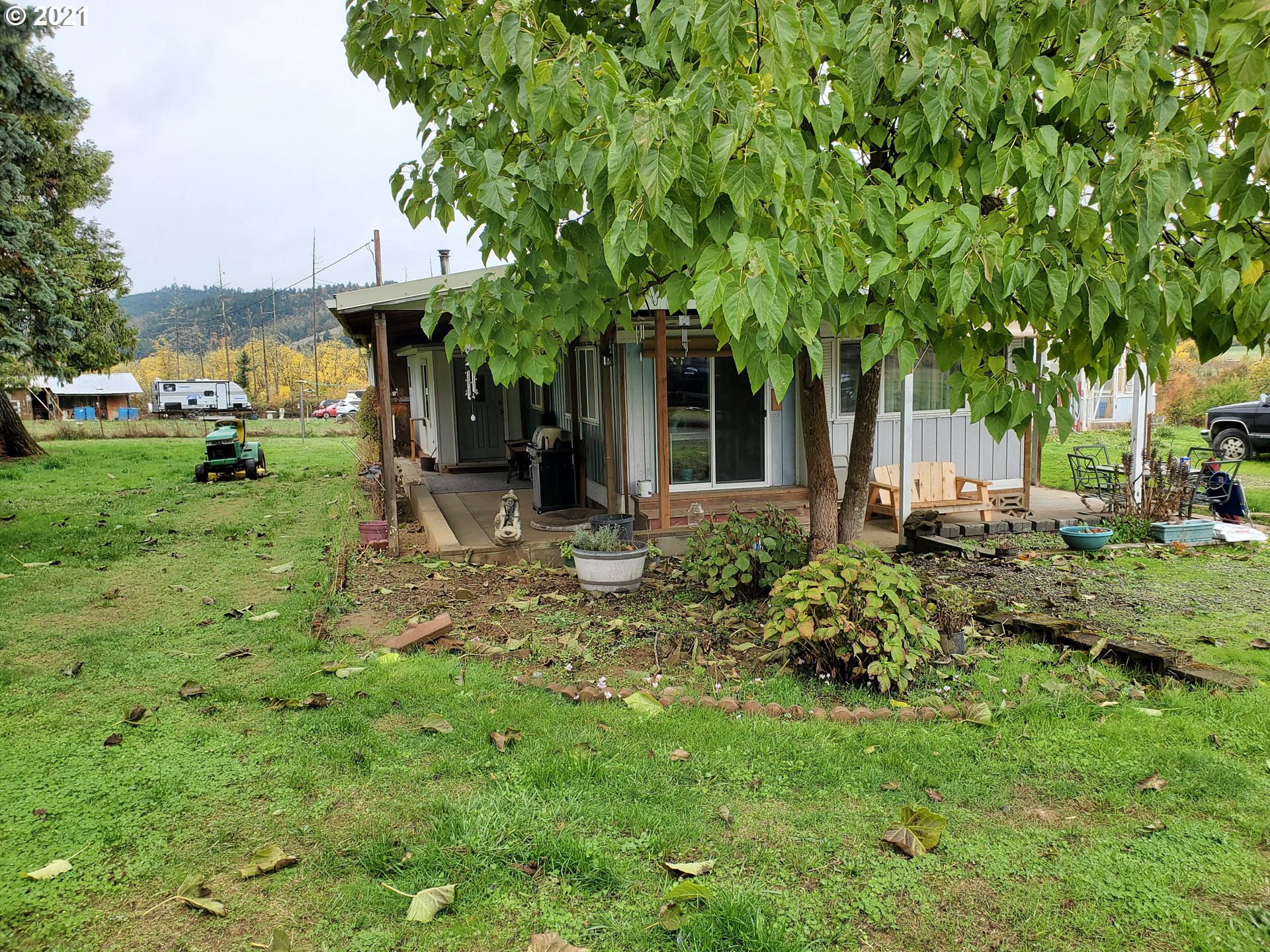 732 Valley View Road Sutherlin, OR 97479 - Photo 9 of 16 a view of a house with backyard garden and sitting area